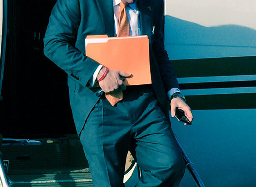 Butch_Jones_exiting_plane_(cropped)