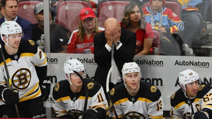 Bruins-coach-Jim-Montgomery-covers-his-face-in-anger